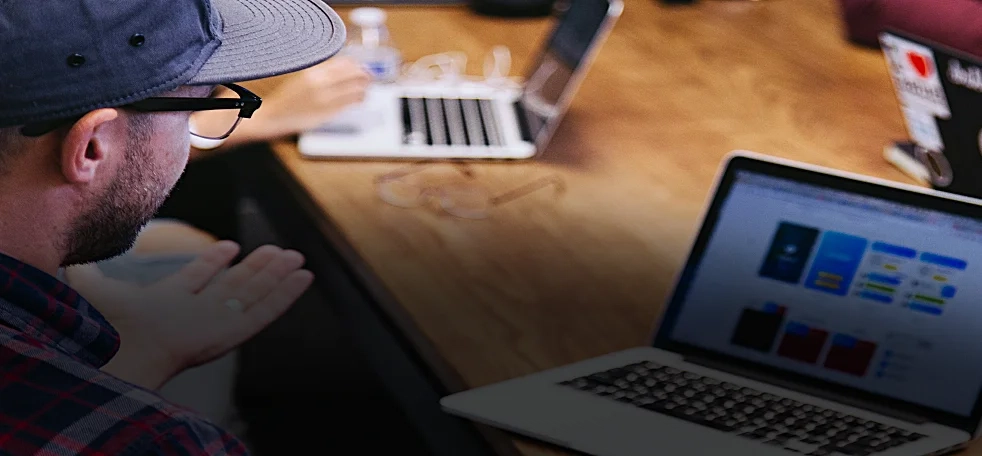 A man operating a laptop.