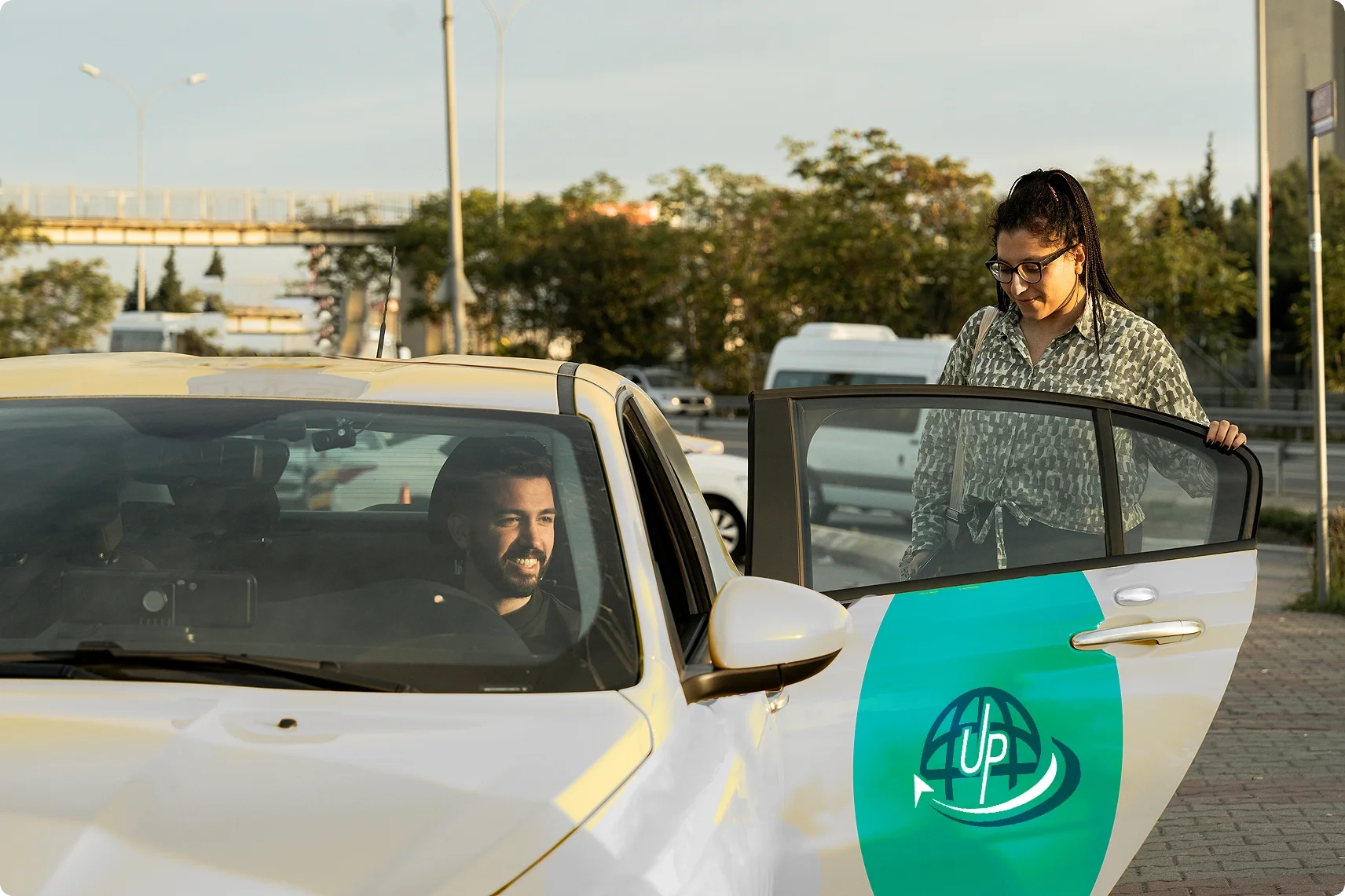Woman stepping into a ride-sharing car.