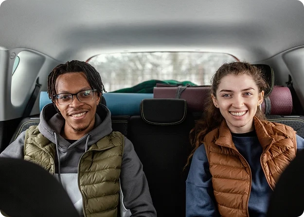 Passengers sharing a ride, highlighting Uprides Share for comfortable, eco-friendly travel and lower fares.